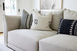 © Trinette Reed/Stocksy - Close-up modern design sofa in interior farmhouse living room pillows