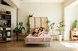 © Malquerida Studio/Stocksy - Lesbian couple lying in bed