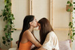 © Malquerida Studio/Stocksy - Woman kiss her girlfriend