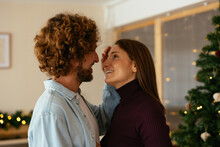 Man Touching Face Of Woman On Christmas Day