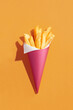 © Marc Tran/Stocksy - french fries in a paper cup  and paper cornet