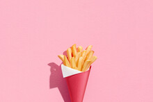 French Fries In A Paper Cup And Paper Cornet