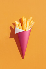 French Fries In A Paper Cup  And Paper Cornet 