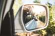 © Akela - from alp to alp/Stocksy - child in side view mirror