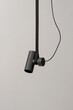 © Andriy Bezuglov/Stocksy - Hanging dark rounded lamp with strap and cable