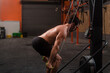© Ibai Acevedo/Stocksy - Crossfit athlete using ski machine at gym