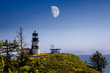 Large Moon Over Lighthouse