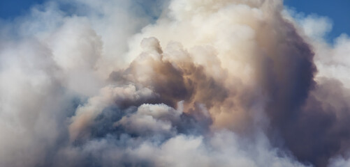 bc forest fire and smoke over the mountain near hope during a hot sunny summer day. british columbia