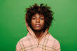© VICTOR TORRES/Stocksy - Sad latin boy with curly hair