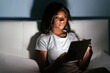 © David Prado/Stocksy - Smiling black woman with tablet