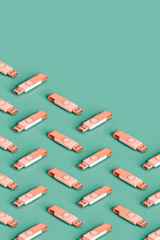 Many Pink Flashdrives On Green Background