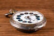 © John - Ornate antique silver pocket watch with decorative dial and patina