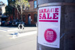 © Rowena Naylor/Stocksy - Garage Sale sign in city street