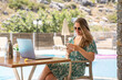 © Hernandez & Sorokina/Stocksy - Woman Using Smartphone In Resort Terrace