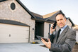© Sean Locke/Stocksy - Real Estate Agent In Phone Discussion