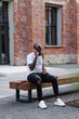 © Oleksii Syrotkin/Stocksy - Guy talking on phone on street