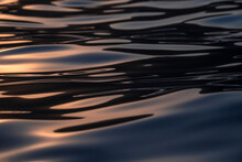 Water Surface At Sunset
