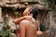 © Lucas Ottone/Stocksy - Woman washing her skin with natural soap