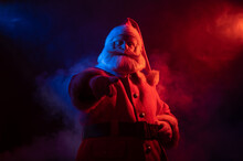 Santa Claus Portrait In Blue Red Neon Light And Smoke. 