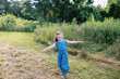 © Serena Burroughs/Stocksy - Little girl spinning and dancing in grass outdoors