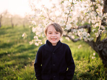 Portrait Of A Little Boy With A Big Smile On A Sunny Spring Evening