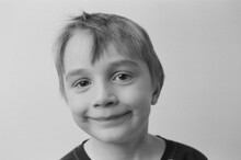 Black And White Studio Portrait Of Little Boy In Sweater