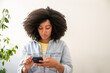 © Hernandez & Sorokina/Stocksy - Woman Using Smartphone