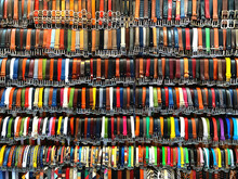 Choice. Full Frame Shoot Of Mutlti-colored Wall Of Belts.