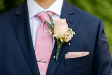 Closeup Of Boutonniere On Groom's Chest