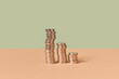 © Yaroslav Danylchenko/Stocksy - Stacks of cent coins on duotone background.