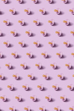 Vertical Wallpaper With Repeated Baby Soothers.
