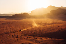 Traveling In The Desert At Sunset