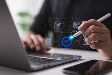 Leinwandbilder - A businessman authenticates an electronic document by signing with a stylus pen on a digital tablet while using the proper sign.