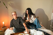 © ByLorena/Stocksy - Couple having breakfast in bedroom