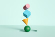 © Pixel Stories/Stocksy - Colored geometric shapes balance concept background
