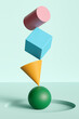 © Pixel Stories/Stocksy - Colored geometric shapes balance concept background