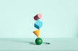 © Pixel Stories/Stocksy - Colored geometric shapes balance concept background