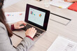 © Ivan Gener/Stocksy - Businesswoman looking at a chart on a laptop