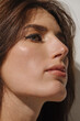 © Liliya Rodnikova/Stocksy - Profile beauty portrait of brunette woman
