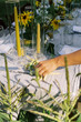 © Serena Burroughs/Stocksy - View of a hand decorating table for a dinner party