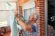 © Santi Nuñez/Stocksy - woman doing the laundry