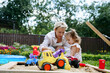© AD Astra Team/Stocksy - Mom and daughter play in the sandbox