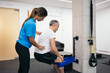 © Pedro Merino/Stocksy - Man doing rehabilitation exercises with his physical therapist
