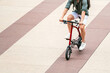 © David Prado/Stocksy - anonymous Man riding electric bicycle on street