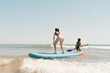 © Eloisa Ramos/Stocksy - Sisters enjoying with kayak at the sea