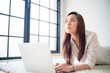 © themorningglory - Business asian woman lying on living room use laptop