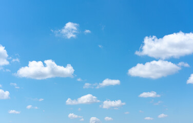 Wall Mural - Clear blue sky background with white clouds