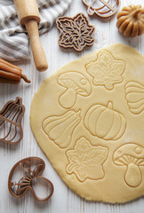 Wall Mural - Baking cookies in the form of pumpkin and leaves