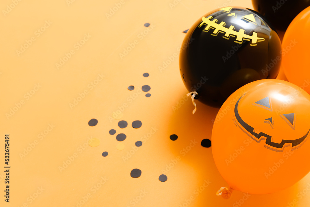 Halloween balloons on color background, closeup