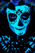 UV body art painting of helloween female skeleton